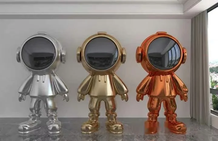 Three Metallic Gold Silver And Copper Astronaut Figurines 3D Model – 14600 – VRAY Render